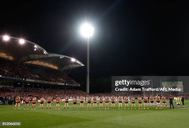 Crows players line up for the national anthem during the 2017 AFL First Preliminary Final match between the Adelaide Crows and the Geelong Cats at...