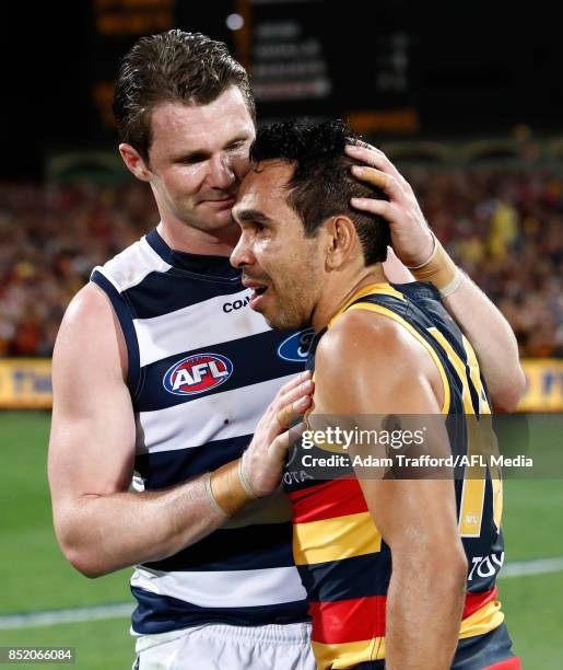 Patrick Dangerfield of the Cats congratulates former Crows teammate Eddie Betts of the Crows during the 2017 AFL First Preliminary Final match...