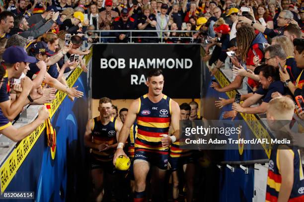 Taylor Walker of the Crows leads the team up the race during the 2017 AFL First Preliminary Final match between the Adelaide Crows and the Geelong...
