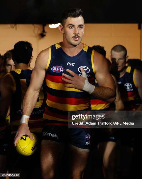 Taylor Walker of the Crows leads the team up the race during the 2017 AFL First Preliminary Final match between the Adelaide Crows and the Geelong...