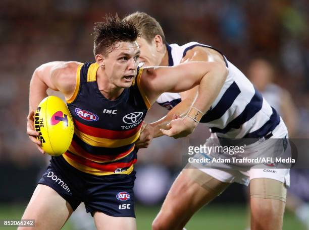 Jake Lever of the Crows in action ahead of Rhys Stanley of the Cats during the 2017 AFL First Preliminary Final match between the Adelaide Crows and...