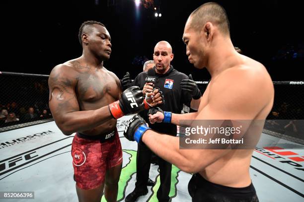 Ovince Saint Preux and Yushin Okami of Japan touch gloves in their light heavyweight bout during the UFC Fight Night event inside the Saitama Super...