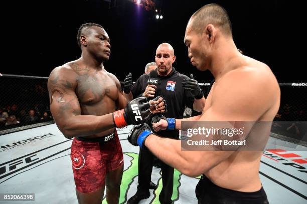 Ovince Saint Preux and Yushin Okami of Japan touch gloves in their light heavyweight bout during the UFC Fight Night event inside the Saitama Super...