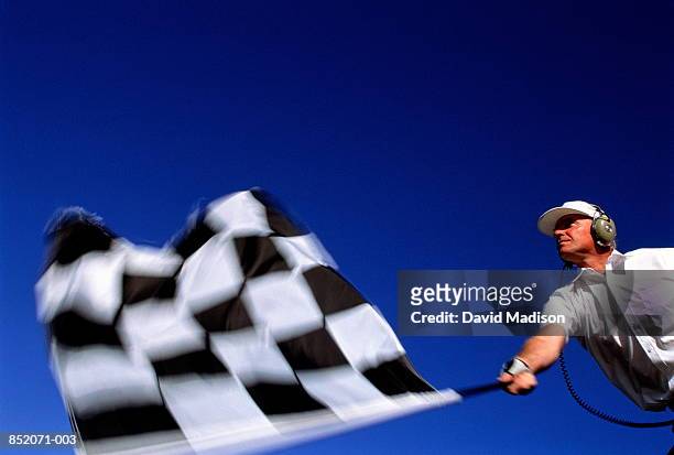 motor racing, official waving chequered flag (blurred motion) - car racing blurred motion bildbanksfoton och bilder