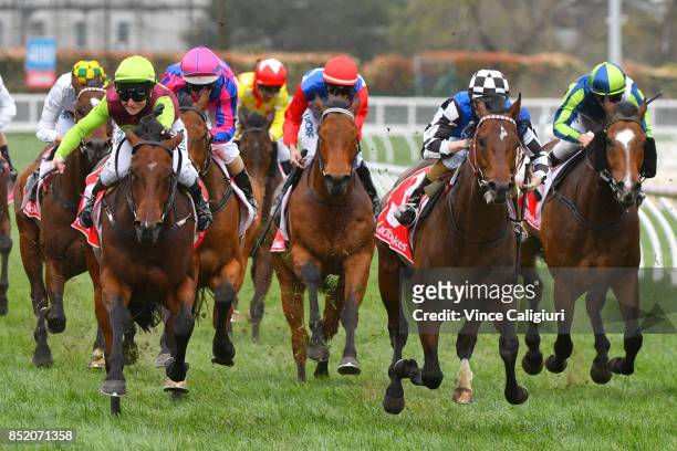 Linda Meech riding Bons Away defeats Damian Lane riding Brave Smash in Race 6 Testa Rossa Stakes during Melbourne Racing at Caulfield Racecourse on...