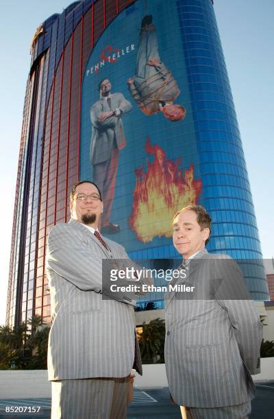 Penn Jillette and Teller of the comedy/magic team Penn & Teller appear in front of a new 28-story tall building wrap of their likeness on the side of...