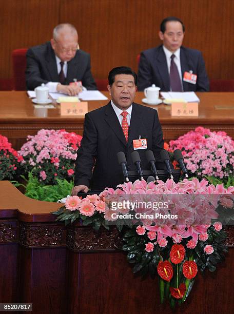 Jia Qinglin, chairman of the Chinese People's Political Consultative Conference delivers his speech during the opening ceremony of the second session...