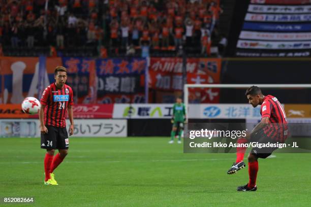 Reis of Consadole Sapporo scores his side's second goal from a free kick during the J.League J1 match between Consadole Sapporo and Albirex Niigata...