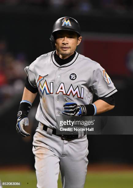 Ichiro Suzuki of the Miami Marlins runs back to the dugout during the third inning against the Arizona Diamondbacks at Chase Field on September 22,...