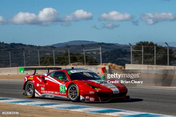The Ferrari of Alessandro Balzan, of Italy, and Christina Nielsen, of Denmark, races on the track during practice for the IMSA WeatherTech Series...