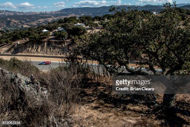 The Ford GT of Ryan Briscoe, of Australia, and Richard Westbrook, of Great Britain, races through the California countryside during practice for the...