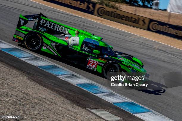 The Nissan DPi of Johannes van Overbeek and Luis Felipe Derani, of Brazil, races on the track during practice for the IMSA WeatherTech Series race at...