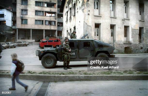 American SFOR soldiers patrol November 16, 2000 in the war-damaged city of Srebrenica, Bosnia. This year marks the fifth anniversary of the signing...