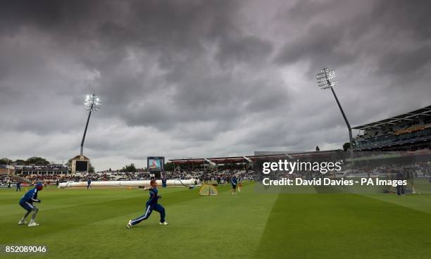 England warm up under dark clouds before the Third One Day International at Edgbaston, Birmingham.