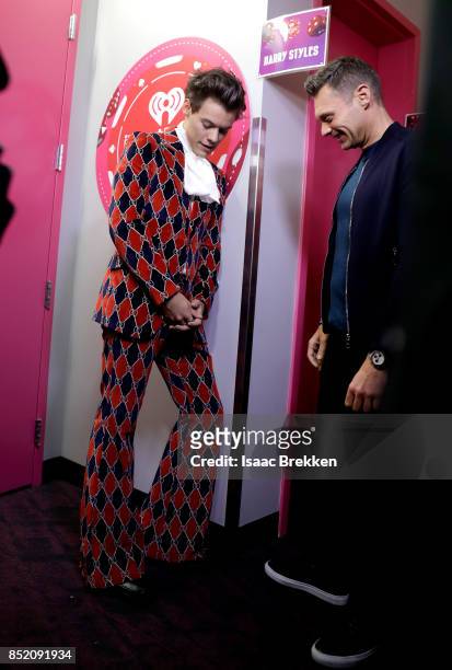 Harry Styles and Ryan Seacrest attend the 2017 iHeartRadio Music Festival at T-Mobile Arena on September 22, 2017 in Las Vegas, Nevada.