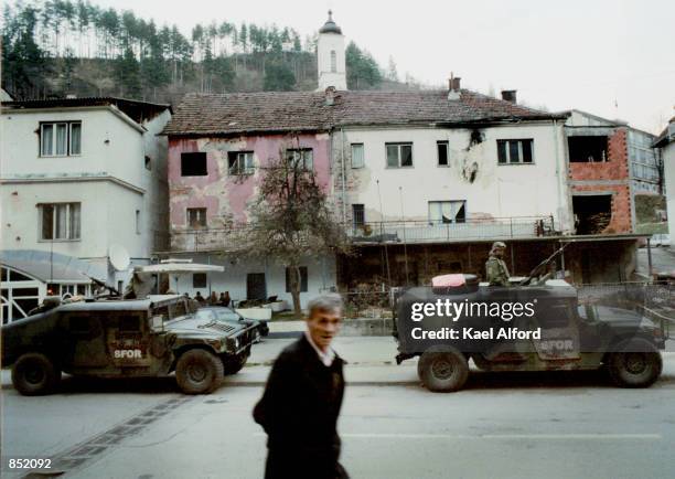 American SFOR soldiers patrol November 16, 2000 in the war-damaged city of Srebrenica, Bosnia. This year marks the fifth anniversary of the signing...