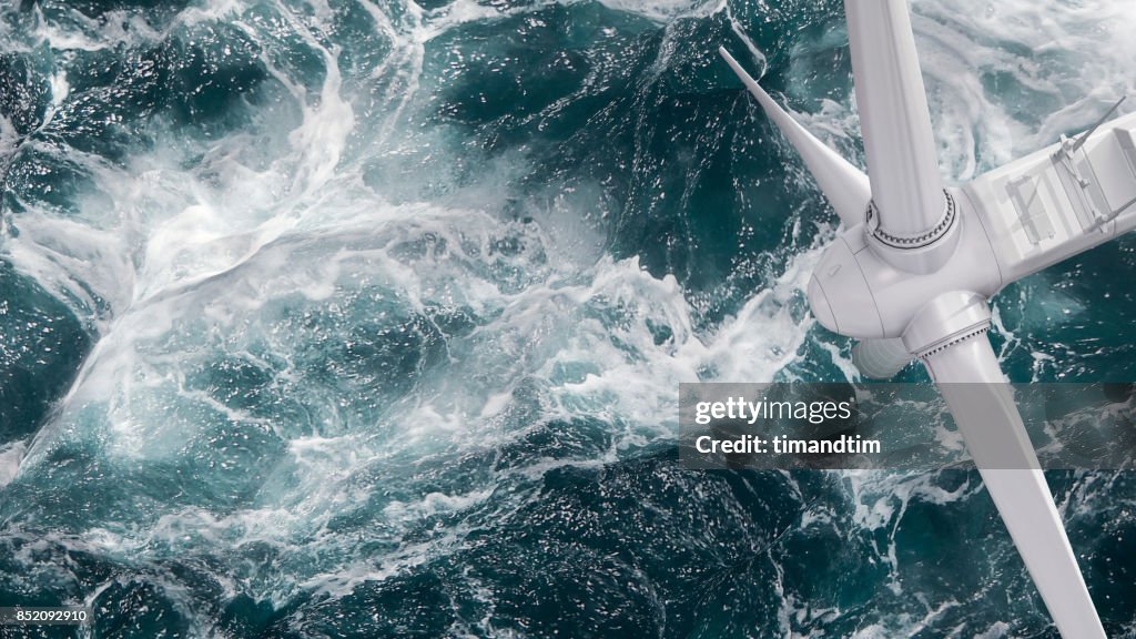 Aerial panorama of a close up wind turbine in the sea