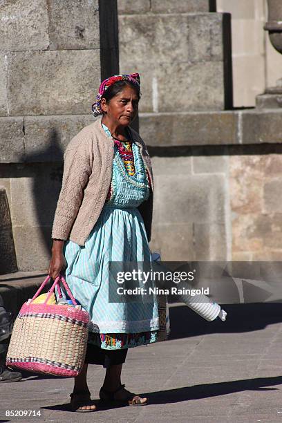 Indigenous woman walks through the Parque Centroamerica on December 12, 2008 in Quetzaltenango, Guatemala. Quetzaltenango is Guatemala�s second...