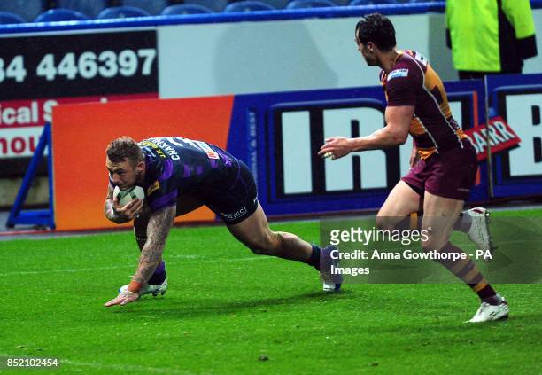 Wigan Warriors' Josh Charnley scores a try during the Super League Elimination Play Off at the John Smith's Stadium, Huddersfield.