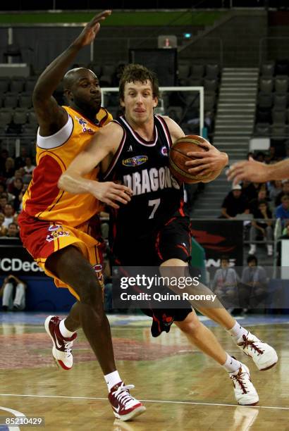 Joe Ingles of the Dragons attempts to get passed Ebi Ere of the Tigers during the game one NBL final match between the South Dragons and the...