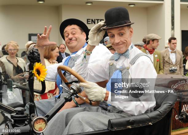 Two actors playing Laurel and Hardy entertain the crowd at the Goodwood Revival.