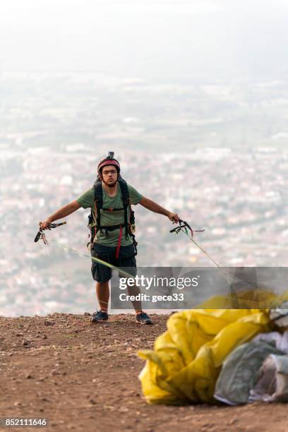 paraglider pilot preparing on pist - farm bailout stock pictures, royalty-free photos & images