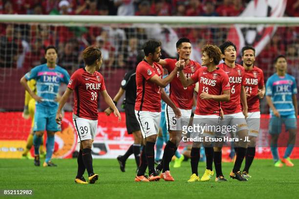 Mauricio of Urawa Red Diamonds celebrates scoring his side's first goal with his team mates during the J.League J1 match between Urawa Red Diamonds...