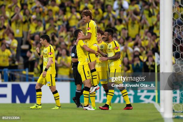 Junya Ito of Kashiwa Reysol celebrates scoring his side's second goal with his team mates during the J.League J1 match between Kashiwa Reysol and FC...