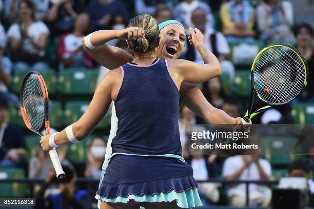 Andreja Klepac of Slovenia celebrates winning with doubles partner Maria Jose Martinez of Spain after defeating Daria Gavrilova of Australia and...