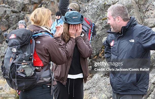 Cheryl Cole, Chris Moyles and Kimberley Walsh comfort each other during a gruelling days trekking on the third day of The BT Red Nose Climb of...