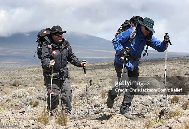 Chris Moyles and Ronan Keating trek on the third day of The BT Red Nose Climb of Kilimanjaro on March 4, 2009 in Arusha, Tanzania. Celebrities Ronan...