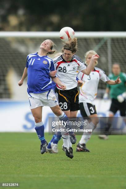 Susana Lehtinen of Finland and Katharina Baunach of Germany go up for a header during the Women Algarve Cup match between Germany and Finland at the...