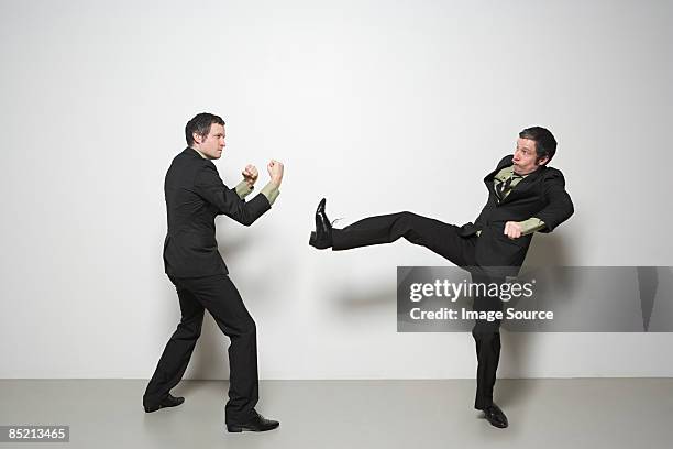 man fighting himself - multiple images of same person stock pictures, royalty-free photos & images