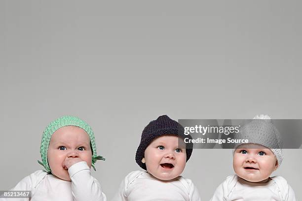 babies in hats - cloning stock-fotos und bilder