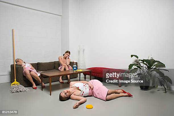 exhausted housewife - multiple images of the same woman stock pictures, royalty-free photos & images