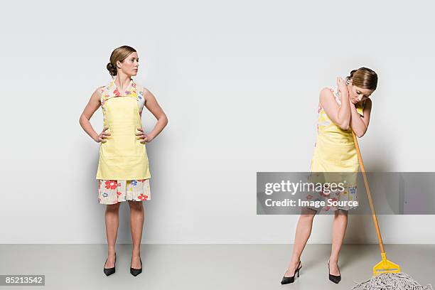 woman with a mop - multiple images of the same woman stock pictures, royalty-free photos & images