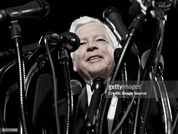 politician and microphones - caucus stock pictures, royalty-free photos & images