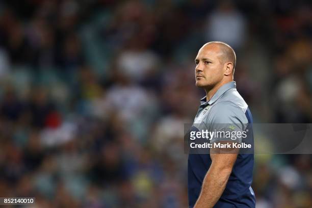 Matt Scott watches on during the warm-up before the NRL Preliminary Final match between the Sydney Roosters and the North Queensland Cowboys at...