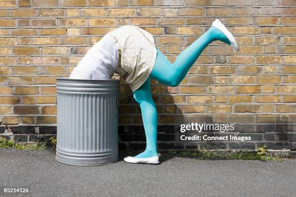 woman looking in a dustbin - searching funny stock pictures, royalty-free photos & images