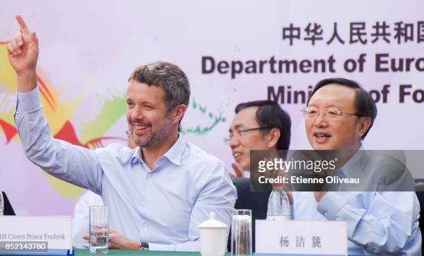 The Crown Prince Frederik of Denmark and Chinese State Counsellor Yang Jiechi celebrate after the first goal in the final of the 3rd Sino-Nordic Cup...