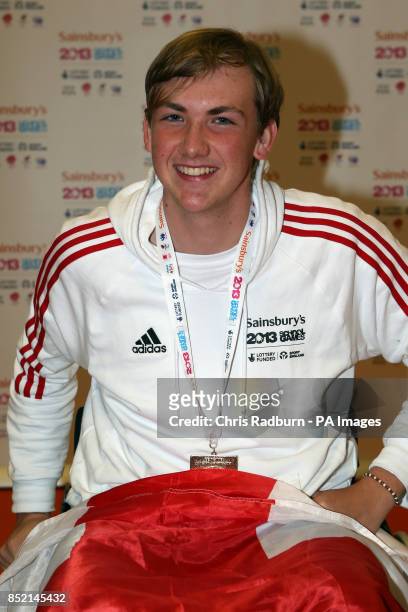 England's Piers Gilliver poses with his fencing mixed sabre wheelchair gold medal on day three of the 2013 Sainsburys School Games at the English...