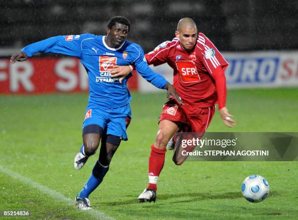 Monaco's French midfielder Nicolas Nkoulou Ndoubena vies with Ajaccio's French defender Carl Medjani during the French cup football match, Ajaccio...