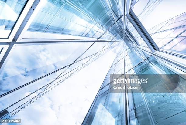 bright future, finance buildings seen from below - glass material stock pictures, royalty-free photos & images