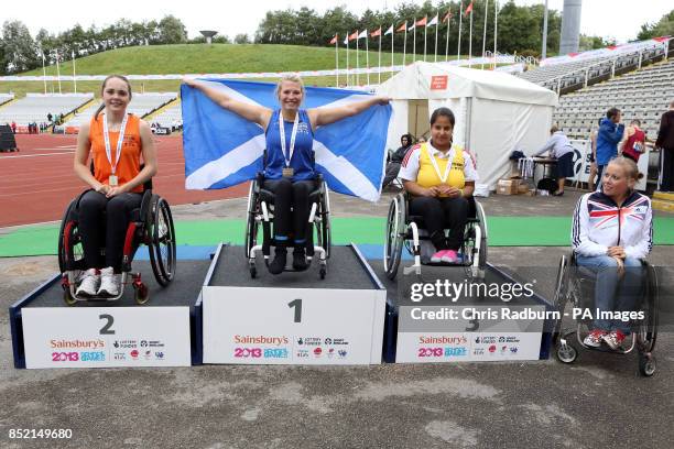 Lauren Rowles, Samantha Kinghorn and Doaa Shayea pose with their girls ambulant 100m medals with Hannah Cockroft on day four of the 2013 Sainsburys...