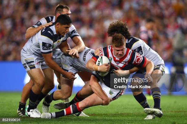 Dylan Napa of the Roosters is tackled during the NRL Preliminary Final match between the Sydney Roosters and the North Queensland Cowboys at Allianz...
