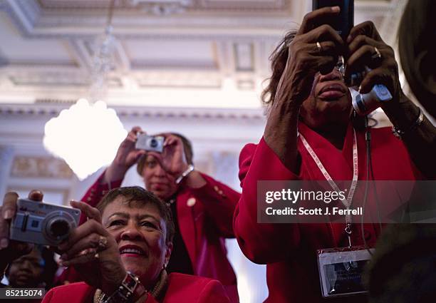 March 03: Delta Sigma Theta Sorority members take pictures of VIPs, including House Speaker Nancy Pelosi, D-Calif., as they unveil a portrait of...