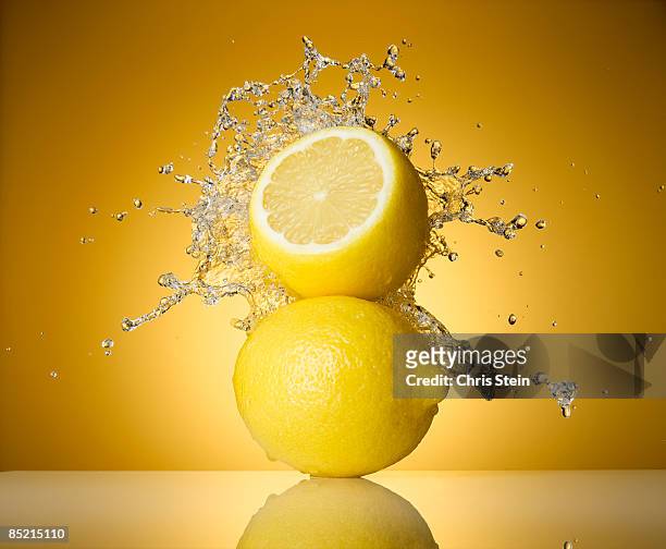 lemon splash - citrus splash stock pictures, royalty-free photos & images