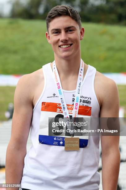 Harry Hughes receives his gold medal on day four of the 2013 Sainsburys School Games at Don Valley Stadium, Sheffield. PRESS ASSOCIATION Photo....