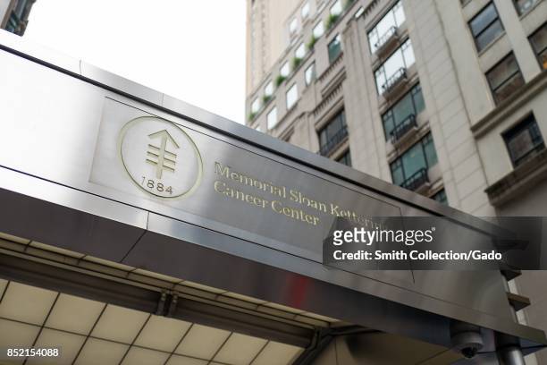 Sign with logo on the facade of the Memorial Sloan Kettering cancer center in Manhattan, New York City, New York, among the top cancer hospitals in...