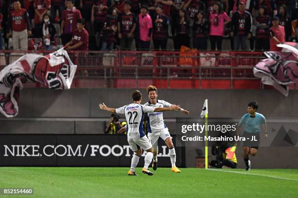 Hwang Ui Jo of Gamba Osaka celebrates scoring his side's first goal with Oh Jae Suk of Gamba Osaka during the J.League J1 match between Kashima...